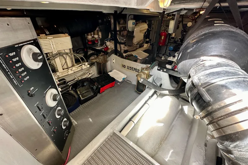 Slide: The Image of Engine room of 2004 Meridian 580 Pilothouse yacht, showcasing control panel and machinery. - 28