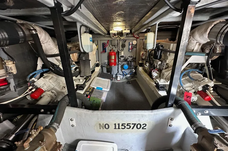 Slide: The Image of Engine room of a 2004 Meridian 580 Pilothouse yacht, showcasing mechanical components and equipment. - 33