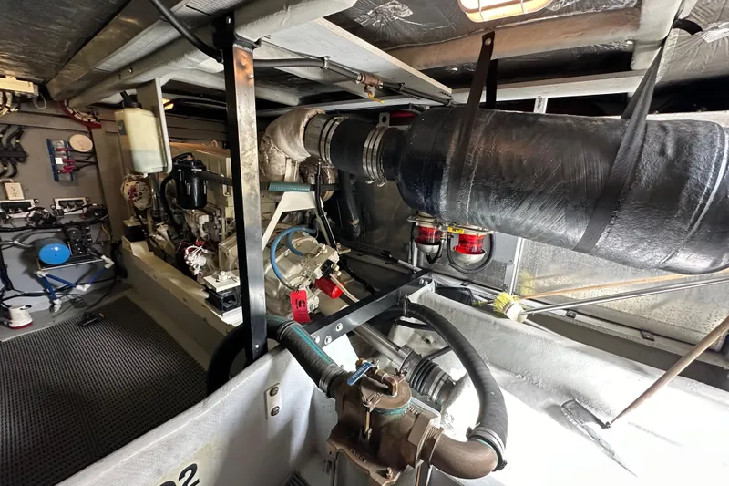 Slide: The Image of Engine room of a 2004 Meridian 580 Pilothouse yacht, showcasing mechanical components. - 34