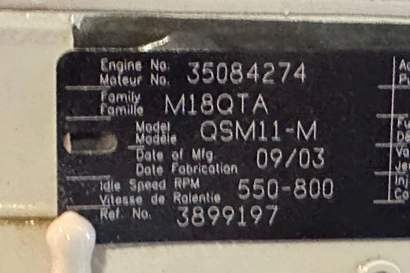 Slide: The Image of Engine plate of a 2004 Meridian 580 Pilothouse, model QSM11-M, idle speed 550-800 RPM. - 35