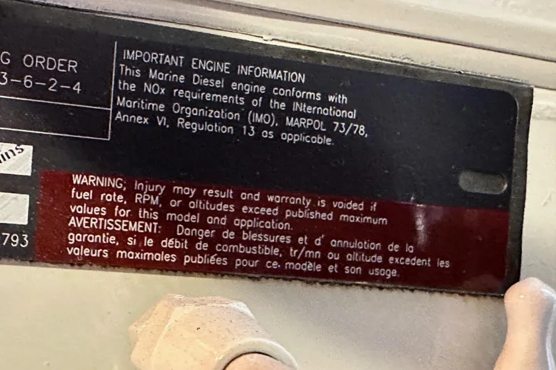 Slide: The Image of Warning label on 2004 Meridian 580 Pilothouse engine, detailing safety and compliance information. - 37
