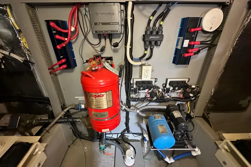 Slide: The Image of Electrical and safety equipment in a 2004 Meridian 580 Pilothouse engine room. - 38