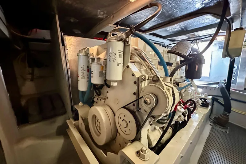 Slide: The Image of Engine room of 2004 Meridian 580 Pilothouse yacht, showcasing mechanical components. - 40