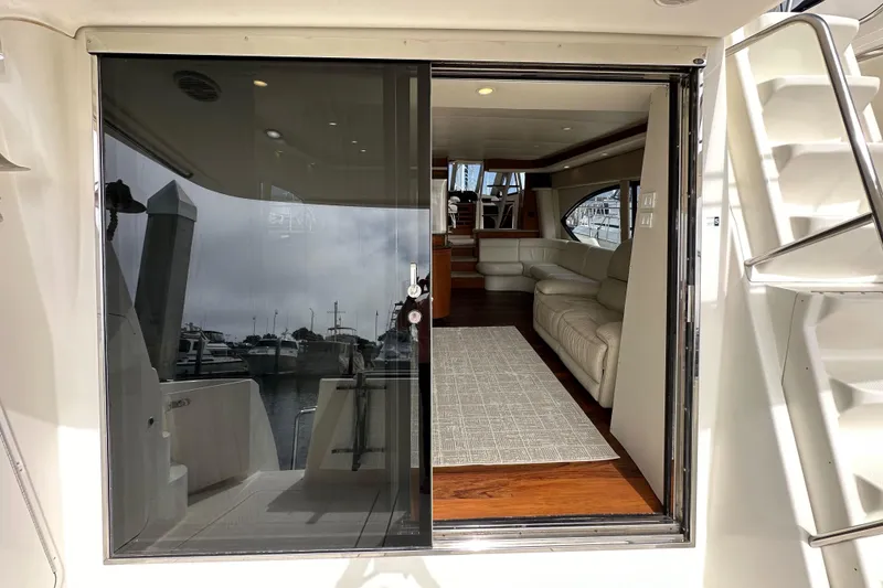 Slide: The Image of Interior view of 2004 Meridian 580 Pilothouse yacht with luxurious seating and modern design. - 42