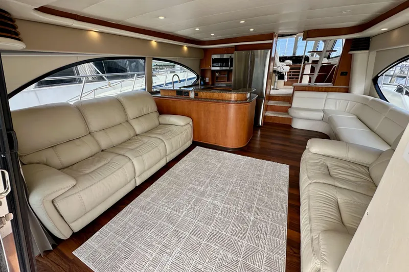 Slide: The Image of Luxurious interior of 2004 Meridian 580 Pilothouse yacht with leather seating and modern kitchen. - 43