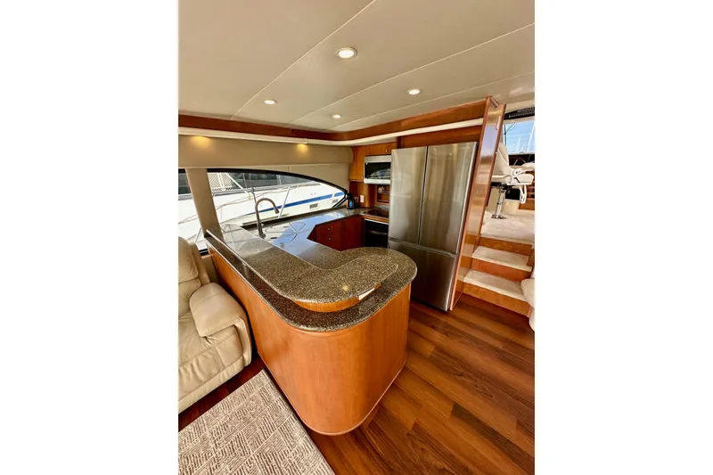 Slide: The Image of Luxurious interior of 2004 Meridian 580 Pilothouse yacht with modern kitchen amenities. - 47