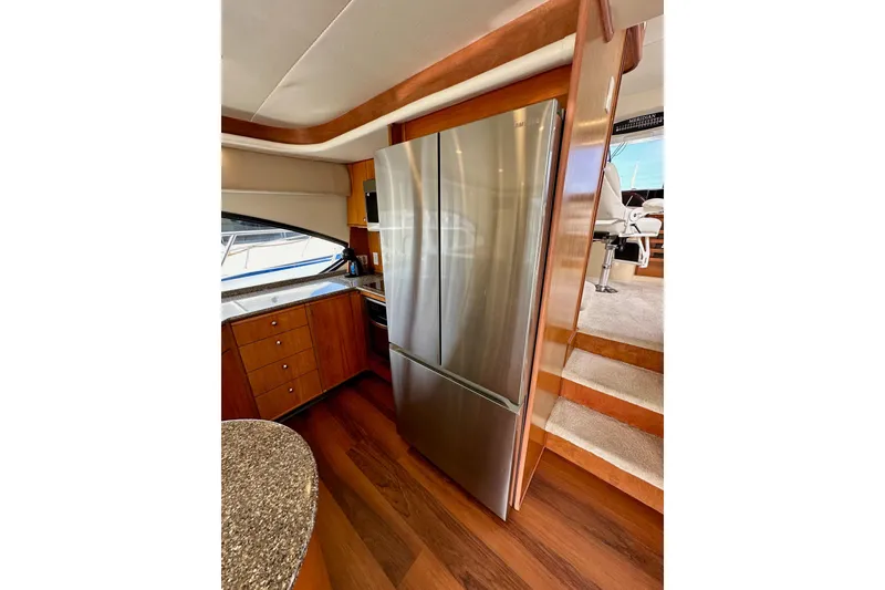 Slide: The Image of Luxurious kitchen area in 2004 Meridian 580 Pilothouse yacht with stainless steel appliances. - 48