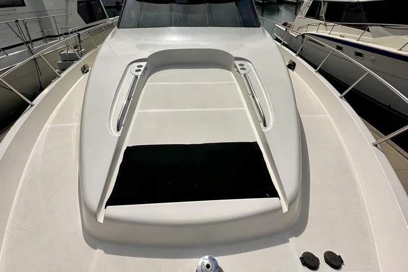 Slide: The Image of 2004 Meridian 580 Pilothouse yacht deck with sleek design and railing details. - 68