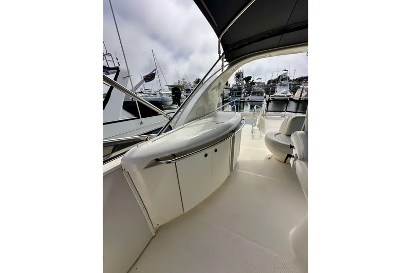 Slide: The Image of 2004 Meridian 580 Pilothouse yacht interior with sleek design and marina view. - 72