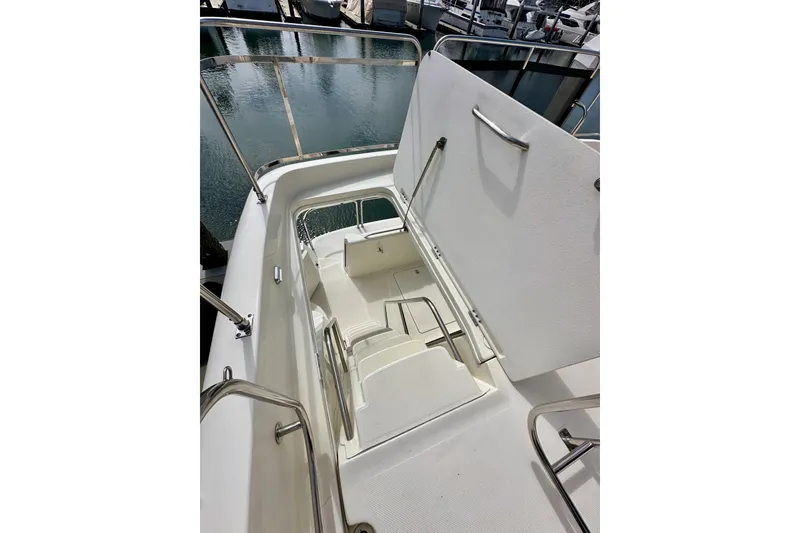 Slide: The Image of Staircase on 2004 Meridian 580 Pilothouse yacht, leading to lower deck, docked at marina. - 77