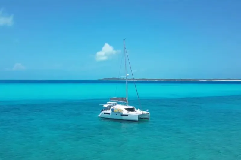 Slide: The Image of Leopard 40 catamaran sailing in clear turquoise waters, 2020 model. - 100