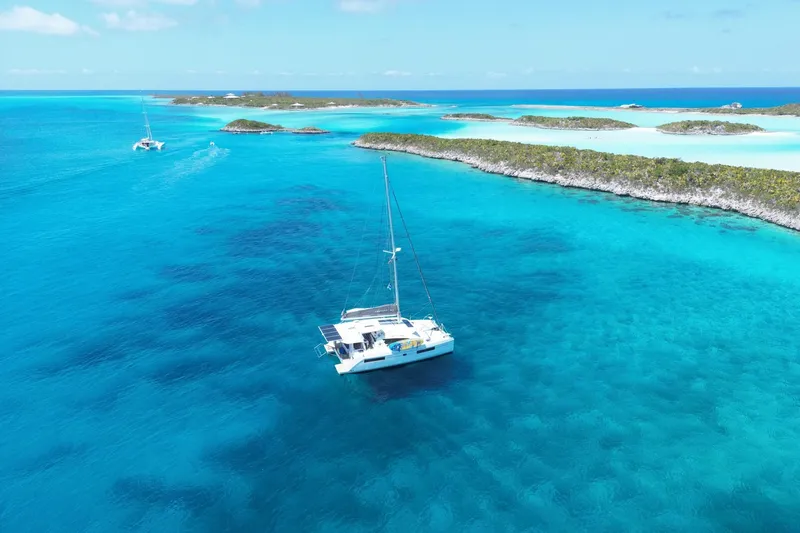 Slide: The Image of Catamaran sailing in clear turquoise waters near tropical islands, Leopard 40 model, 2020. - 102