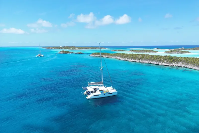 Slide: The Image of Catamaran Leopard 40 sailing in clear blue waters near tropical islands, 2020 model. - 103