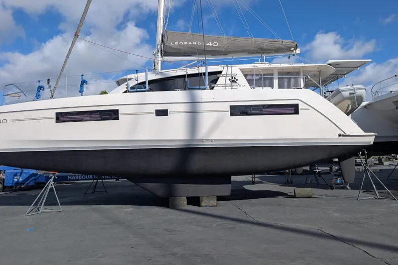 Slide: The Image of 2020 Leopard 40 catamaran on dry dock under clear blue sky. - 116