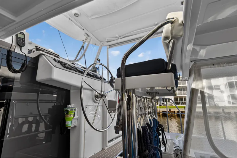 Slide: The Image of Helm station of 2020 Leopard 40 catamaran with steering wheel and navigation equipment. - 20