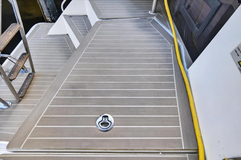 Slide: The Image of Deck of 2020 Leopard 40 yacht with wooden steps and yellow cable. - 28