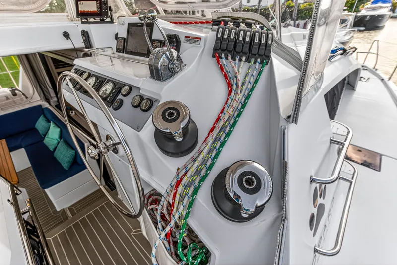 Slide: The Image of Helm of 2020 Leopard 40 catamaran with steering wheel, control panel, and colorful ropes. - 34