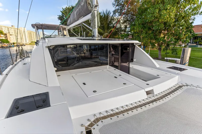 Slide: The Image of 2020 Leopard 40 catamaran docked, featuring spacious deck and modern design. - 39