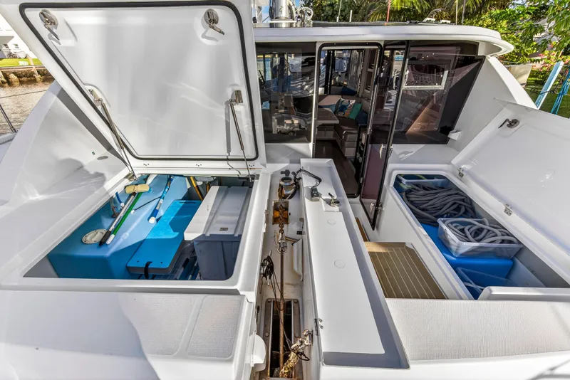 Slide: The Image of 2020 Leopard 40 catamaran deck with open storage compartments and interior view. - 42