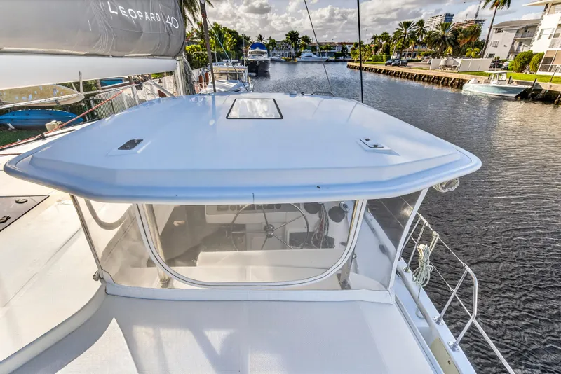 Slide: The Image of 2020 Leopard 40 catamaran on a scenic waterway, showcasing sleek design and modern features. - 51