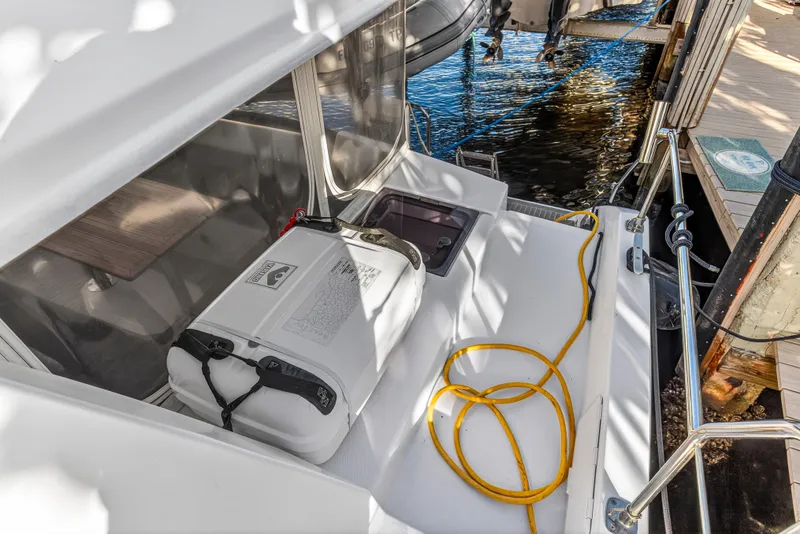 Slide: The Image of Leopard 40 catamaran deck with safety equipment and yellow rope, docked by water. - 53