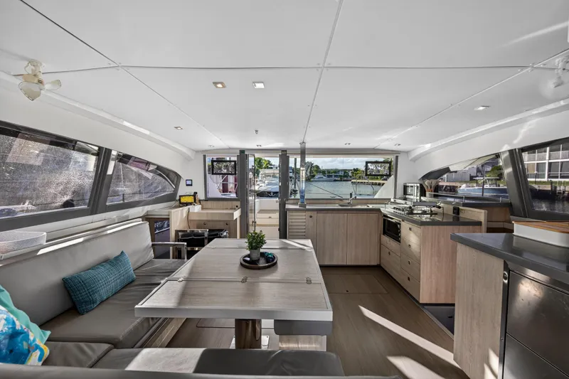 Slide: The Image of Modern interior of a 2020 Leopard 40 catamaran with spacious seating and kitchen area. - 57