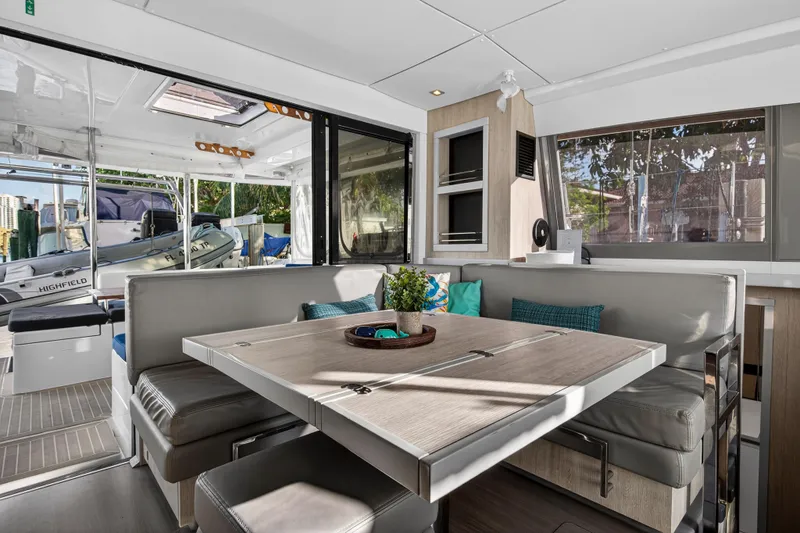 Slide: The Image of Leopard 40 catamaran interior with modern dining area, featuring sleek design and comfortable seating. - 60