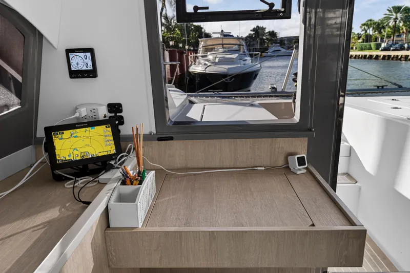 Slide: The Image of Interior of 2020 Leopard 40 yacht with navigation equipment and marina view. - 68