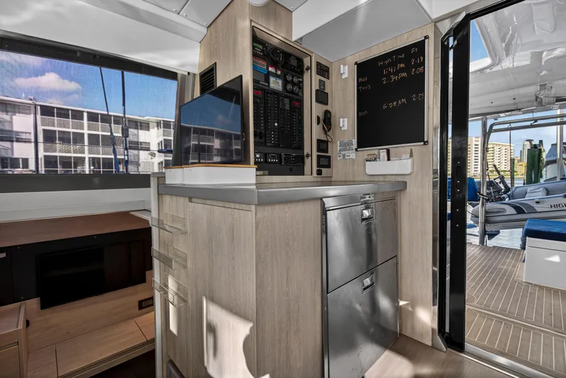 Slide: The Image of Interior of 2020 Leopard 40 yacht with control panel and outdoor view. - 69