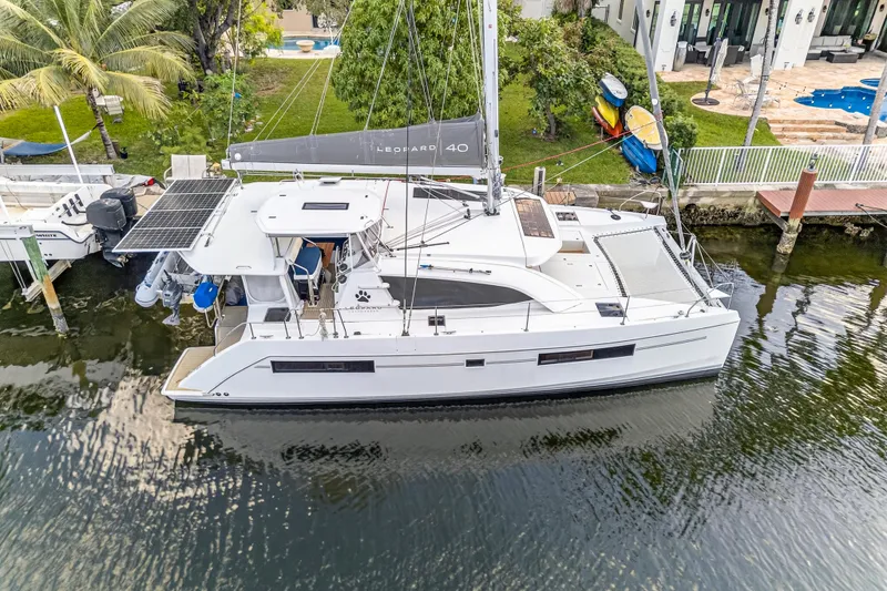Slide: The Image of Aerial view of 2020 Leopard 40 catamaran docked by waterfront property. - 7