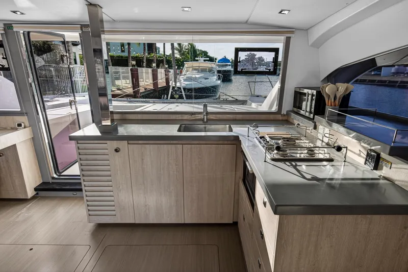 Slide: The Image of Modern kitchen interior on a 2020 Leopard 40 yacht, featuring sleek countertops and appliances. - 73