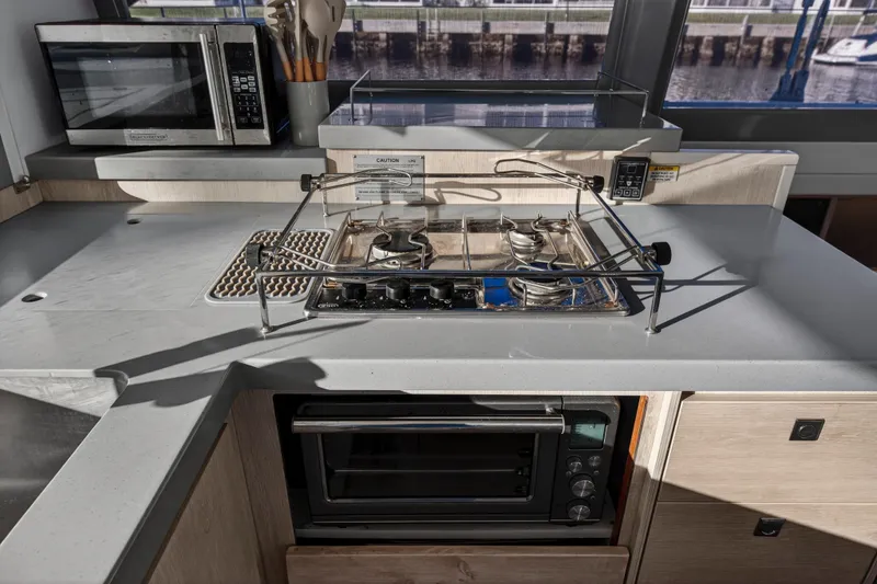 Slide: The Image of Modern kitchen in 2020 Leopard 40 yacht with stove, oven, and microwave. - 74