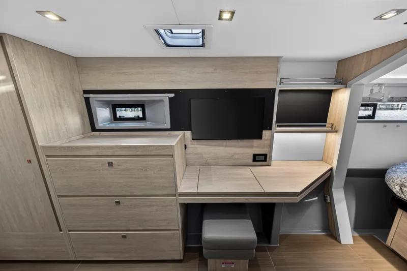 Slide: The Image of Modern interior of 2020 Leopard 40 yacht with desk, TV, and storage cabinets. - 80