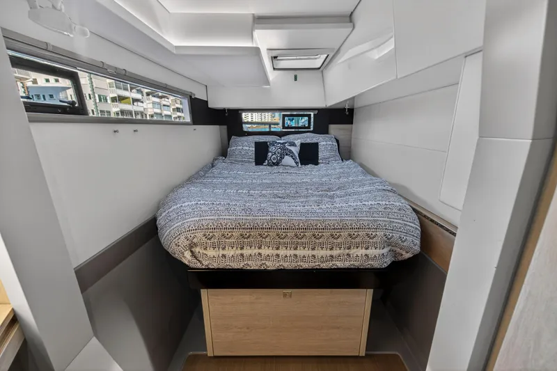 Slide: The Image of Modern bedroom interior on a 2020 Leopard 40 yacht, featuring a cozy bed and stylish decor. - 82