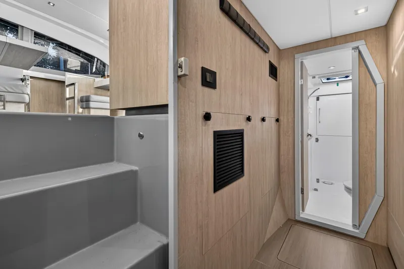 Slide: The Image of Interior of 2020 Leopard 40 yacht featuring modern bathroom and wooden paneling. - 84