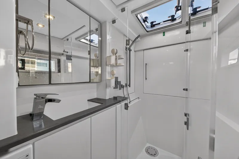 Slide: The Image of Modern bathroom interior on 2020 Leopard 40 yacht, featuring sleek fixtures and ample lighting. - 85