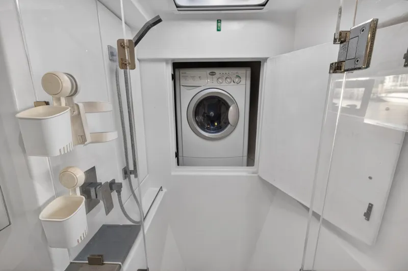 Slide: The Image of Laundry area in 2020 Leopard 40 yacht with washing machine and storage. - 86