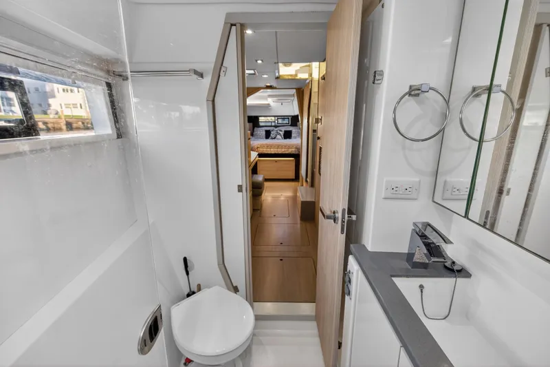 Slide: The Image of Modern bathroom interior on a 2020 Leopard 40 yacht, featuring sleek fixtures and wood accents. - 87