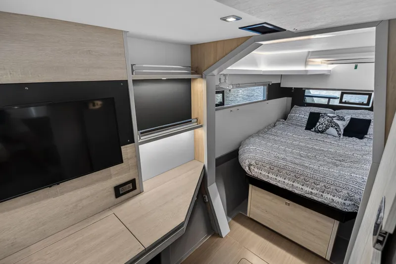 Slide: The Image of Modern interior of 2020 Leopard 40 yacht with cozy bedroom and TV area. - 89