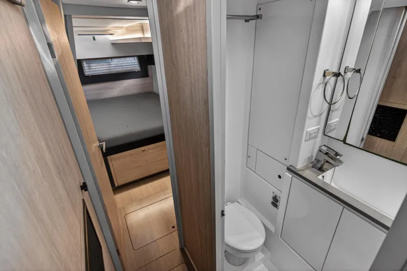 Slide: The Image of Modern interior of 2020 Leopard 40 yacht featuring compact bathroom and cozy bedroom. - 91