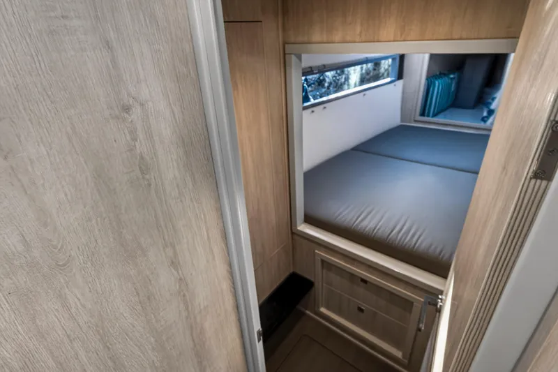 Slide: The Image of Interior cabin of 2020 Leopard 40 catamaran with wooden finish and cozy bed. - 92