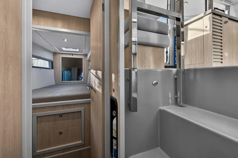 Slide: The Image of Interior of 2020 Leopard 40 catamaran, featuring modern cabin and sleek wooden finishes. - 93