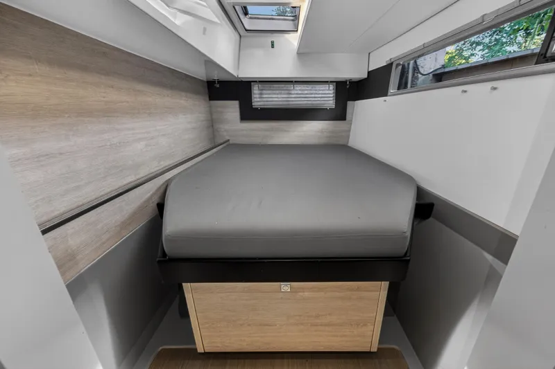 Slide: The Image of Modern bedroom interior in 2020 Leopard 40 yacht with skylight and sleek design. - 96