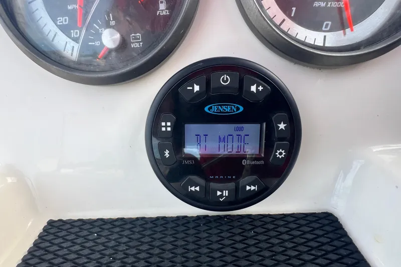 Slide: The Image of Dashboard of 2020 Bayliner Element F18 with Jensen marine audio system. - 15