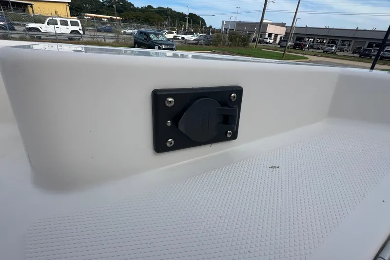 Slide: The Image of 2020 Bayliner Element F18 boat deck with a mounted electrical outlet. - 19