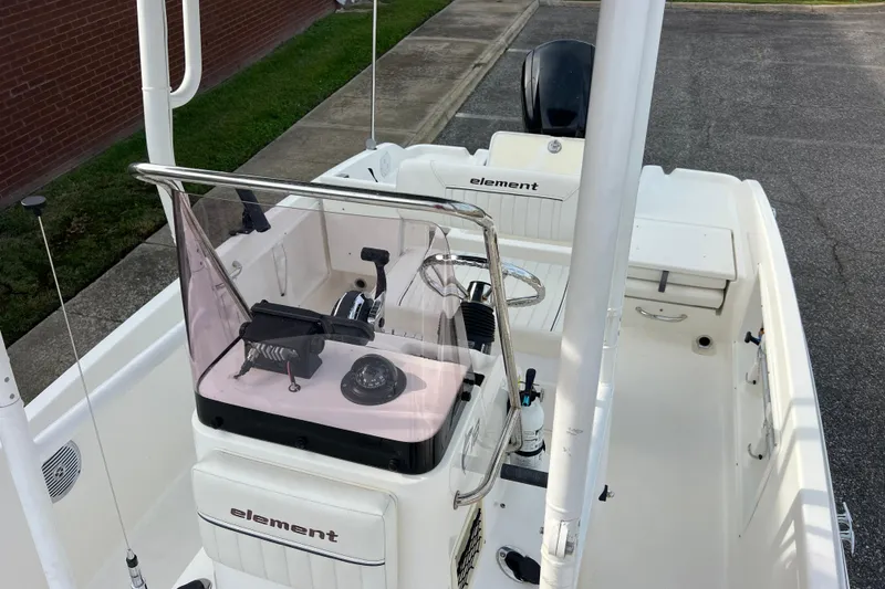 Slide: The Image of 2020 Bayliner Element F18 boat interior with steering console and seating. - 25