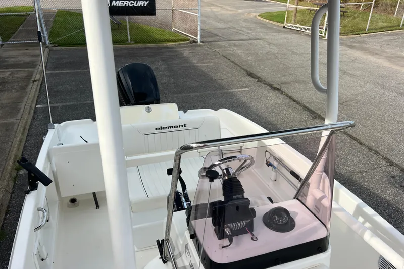 Slide: The Image of 2020 Bayliner Element F18 boat interior with steering console and seating. - 26