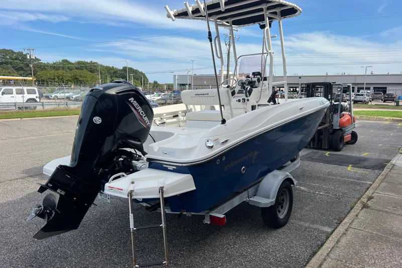 Slide: The Image of 2020 Bayliner Element F18 boat on trailer with Mercury outboard motor. - 4