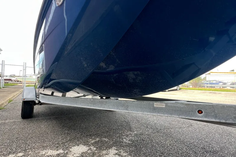 Slide: The Image of 2020 Bayliner Element F18 boat on trailer, showcasing hull design. - 7