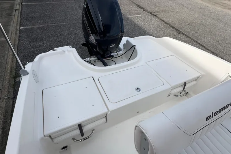 Slide: The Image of 2020 Bayliner Element F18 boat with outboard motor and seating area. - 9